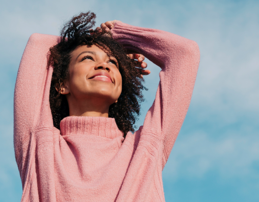 A women standing outside with smile